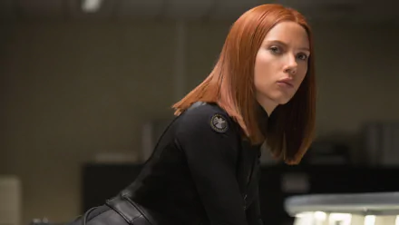 Scarlett Johansson as Black Widow in a scene from Captain America: The Winter Soldier. This HD wallpaper captures her intense expression and iconic look.