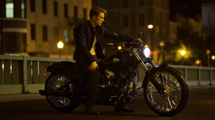 Steve Rogers, portrayed by Chris Evans, sits on a Harley-Davidson motorcycle in a nighttime setting from the movie Captain America: The Winter Soldier, featured as a HD desktop wallpaper.
