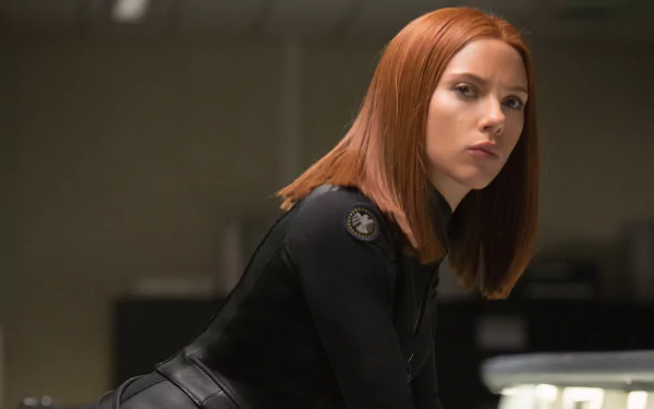Scarlett Johansson as Black Widow in a scene from Captain America: The Winter Soldier. This HD wallpaper captures her intense expression and iconic look.