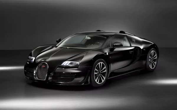 Black Bugatti Veyron Grand Sport Vitesse showcased as a sleek, high-performance vehicle in a dark, minimalistic HD desktop wallpaper background.