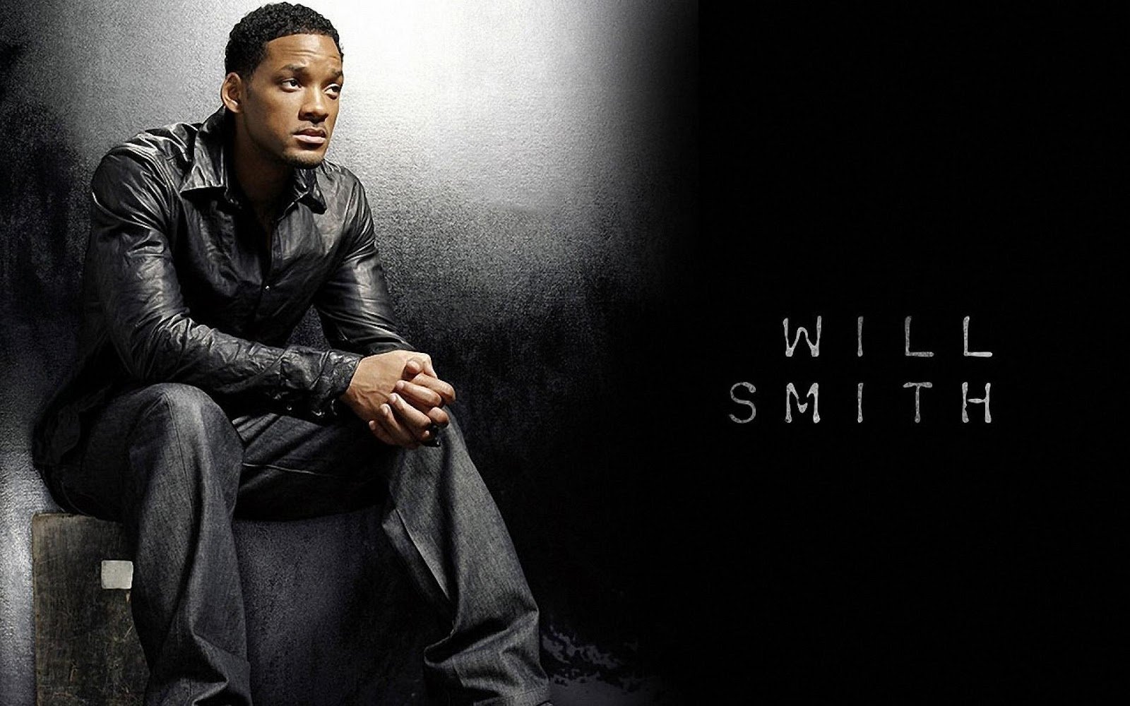 HD PC desktop wallpaper featuring celebrity Will Smith seated against a dark, textured background with his name displayed beside him.