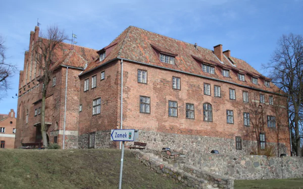 Kętrzyn Castle in Warmian-Masurian, Poland, showcases historic European architecture under a clear blue sky, captured in sharp HD detail.