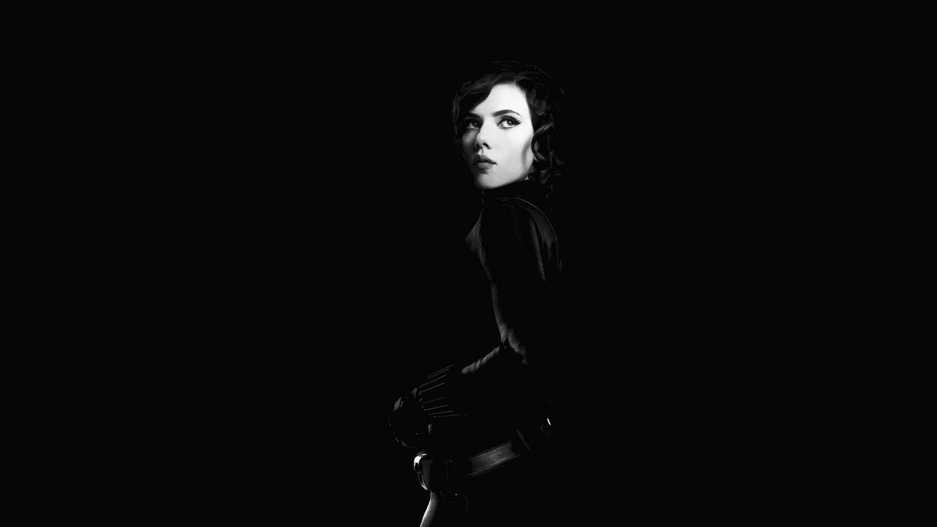 HD PC desktop wallpaper featuring a dramatic black-and-white portrait of Black Widow from the Avengers movie, set against a dark background.