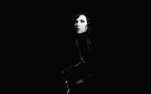 HD PC desktop wallpaper featuring a dramatic black-and-white portrait of Black Widow from the Avengers movie, set against a dark background.