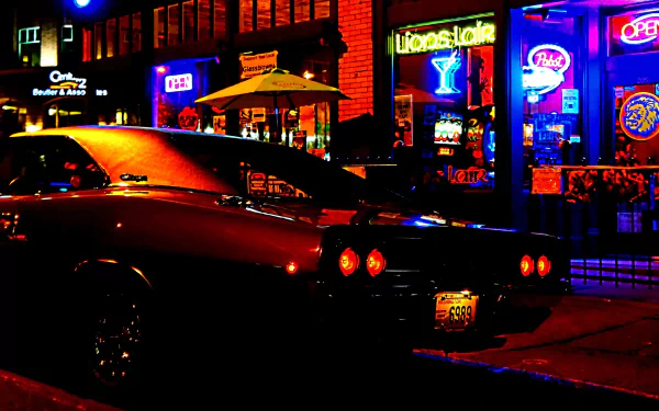 HD PC desktop wallpaper of a Dodge Charger parked under neon lights on a nighttime city street, rear view with glowing taillights and colorful storefront signs.