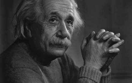 HD desktop wallpaper featuring a thoughtful Albert Einstein in a black-and-white portrait.