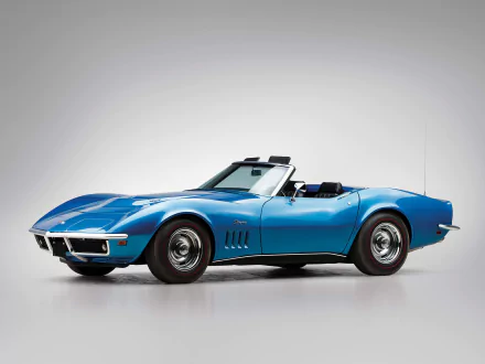 Blue Chevrolet Corvette Stingray Convertible, side profile in a studio setting on a neutral backdrop — HD PC desktop wallpaper and background showcasing the vehicle.
