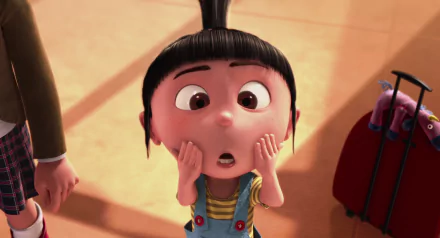 Agnes from Despicable Me gazes wide-eyed, her hands on her cheeks, in this vibrant HD desktop wallpaper, capturing her adorable and expressive character from the beloved movie.