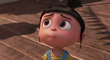 A high-definition desktop wallpaper featuring Agnes from Despicable Me, showcasing her adorable expression and big, expressive eyes in a charming animated scene.