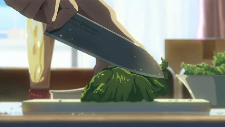 HD desktop wallpaper from The Garden of Words depicting a detailed scene of a hand cutting vegetables with a knife.