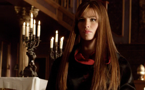 HD PC desktop wallpaper featuring a scene from the movie Elektra, showcasing the character in a dimly lit, candle-filled setting.