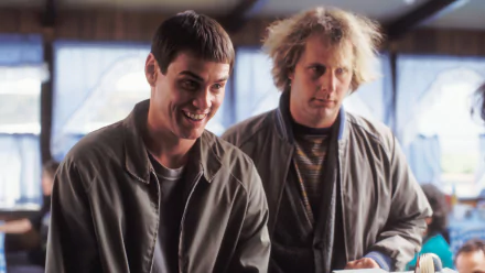 HD desktop wallpaper from Dumb and Dumber To featuring two men in casual attire with comically contrasting expressions.