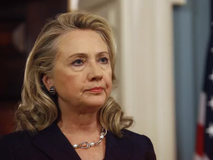 HD desktop wallpaper featuring a close-up image of Hillary Rodham Clinton against an elegant backdrop.