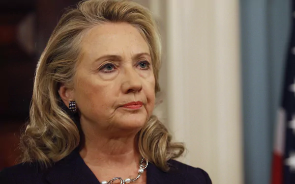 HD desktop wallpaper featuring a close-up image of Hillary Rodham Clinton against an elegant backdrop.