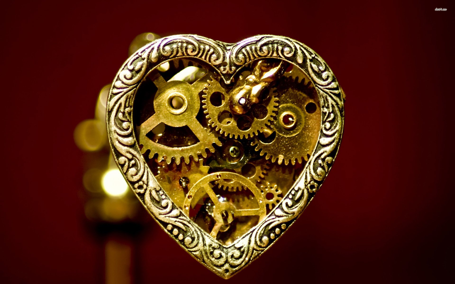 Intricate steampunk heart adorned with gears and clockwork, set against a rich background, creating a captivating Sci-Fi atmosphere. High-definition wallpaper for PC desktops.