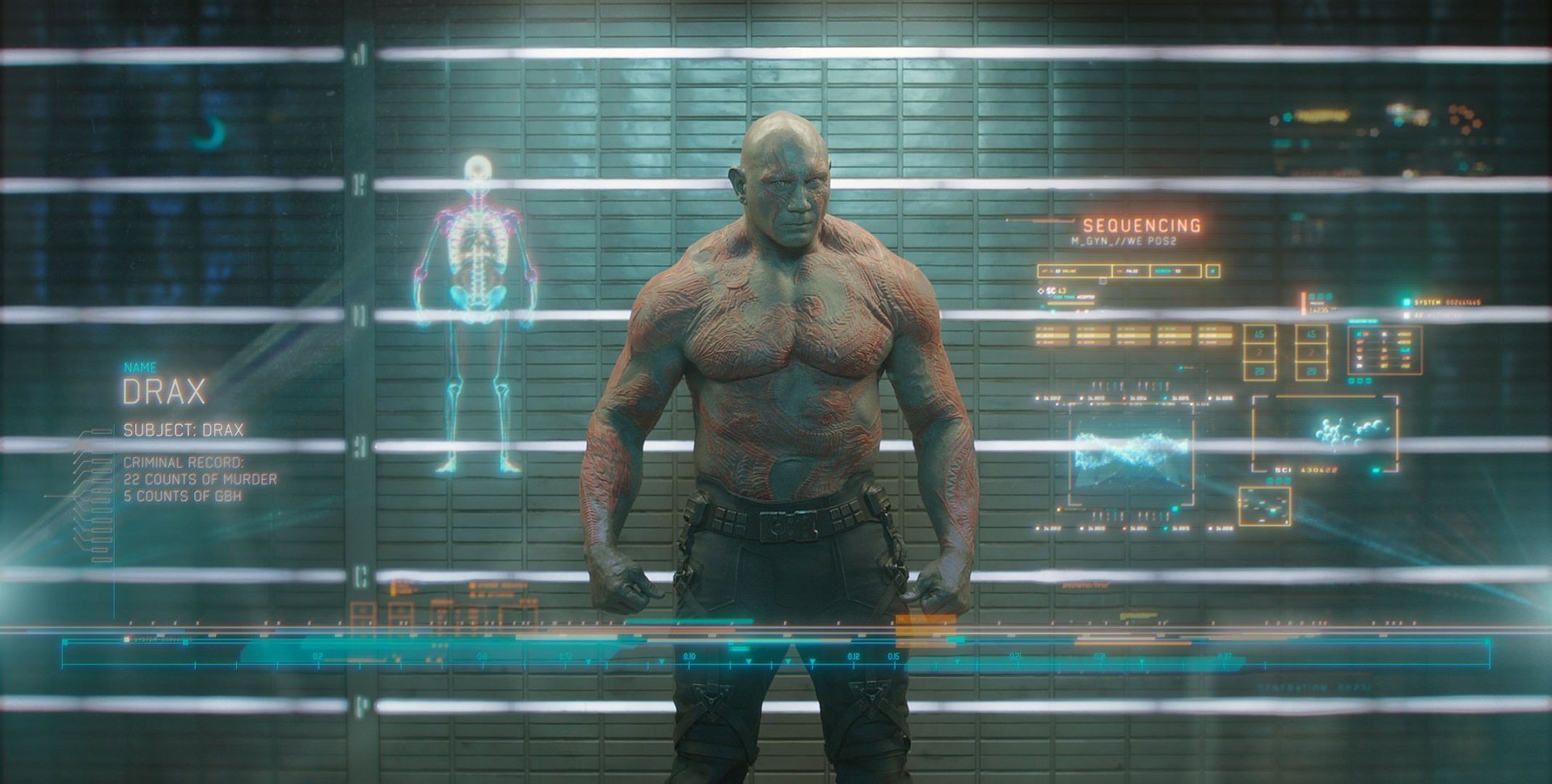 HD PC desktop wallpaper of Drax the Destroyer from the Guardians of the Galaxy movie — shirtless, tattooed, standing in front of holographic diagnostics and a sci‑fi interface.