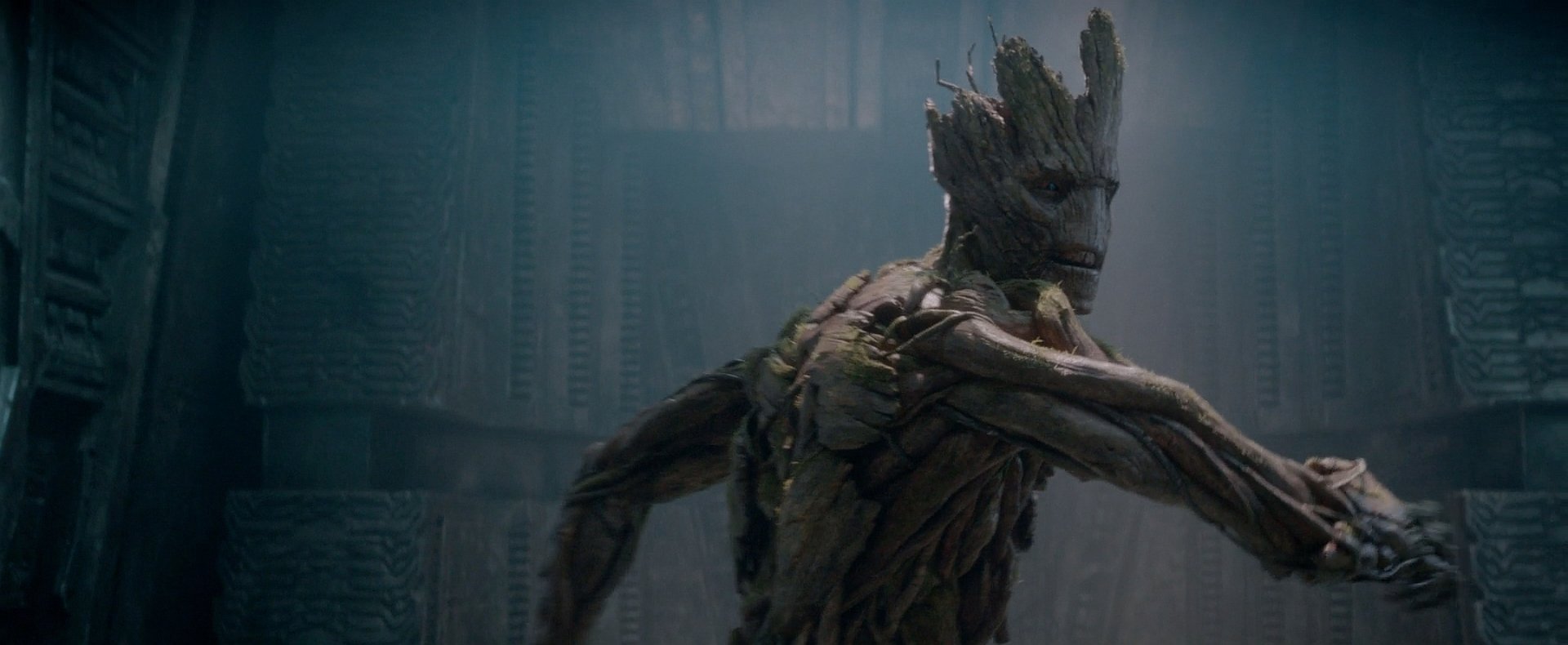 HD PC desktop wallpaper featuring Groot from the movie Guardians of the Galaxy, showcasing his detailed wooden texture in a dark, atmospheric setting.