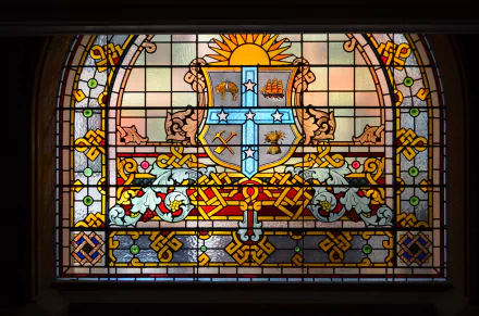 Colorful stained glass window from Sydney’s Queen Victoria Building, featuring intricate patterns and vibrant hues, displayed as an HD PC desktop wallpaper background.