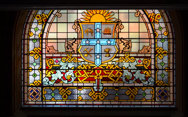 Colorful stained glass window from Sydney’s Queen Victoria Building, featuring intricate patterns and vibrant hues, displayed as an HD PC desktop wallpaper background.