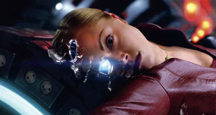 A close-up of a character from Terminator 3: Rise of the Machines, showcasing a dramatic moment with a glowing eye and liquid metallic elements. Suitable as a HD PC wallpaper and background.