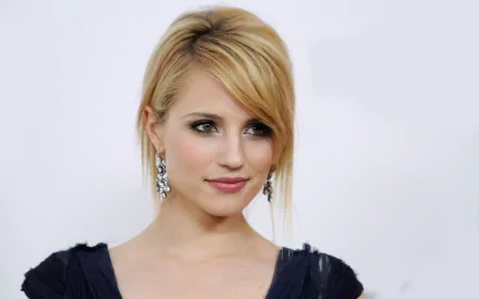 HD desktop wallpaper featuring American actress and celebrity Dianna Agron with a soft smile and elegant earrings against a light background.
