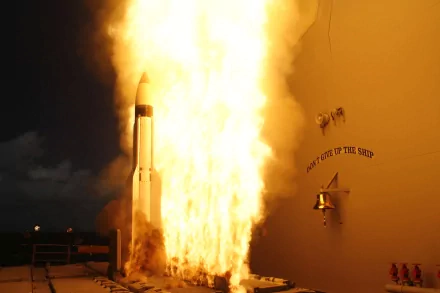 A military missile launching amid a powerful explosion, creating an intense scene. This HD image serves as a striking desktop wallpaper and background.