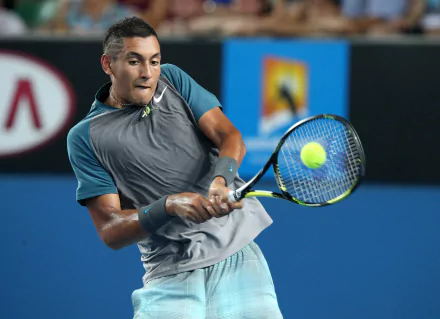 Nick Kyrgios showcases his tennis skills in this dynamic HD wallpaper, featuring him in action during a match, capturing the intensity of sports.