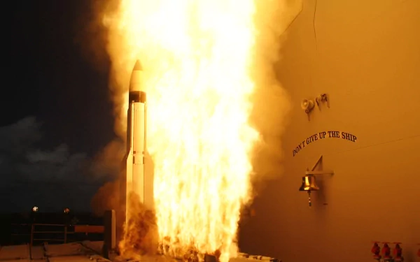 A military missile launching amid a powerful explosion, creating an intense scene. This HD image serves as a striking desktop wallpaper and background.