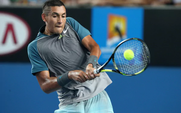 Nick Kyrgios showcases his tennis skills in this dynamic HD wallpaper, featuring him in action during a match, capturing the intensity of sports.