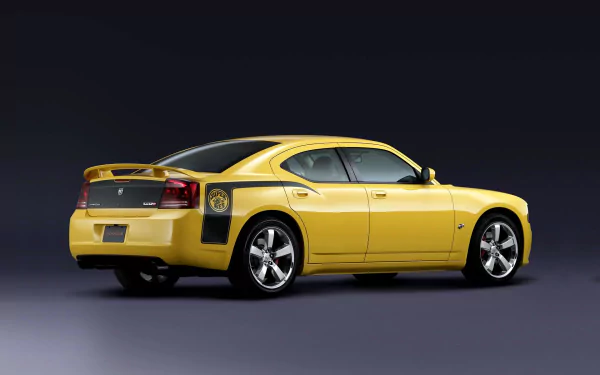 Yellow Dodge Charger SRT8 Superbee showcased on a sleek dark background, featured as an HD PC desktop wallpaper and background.