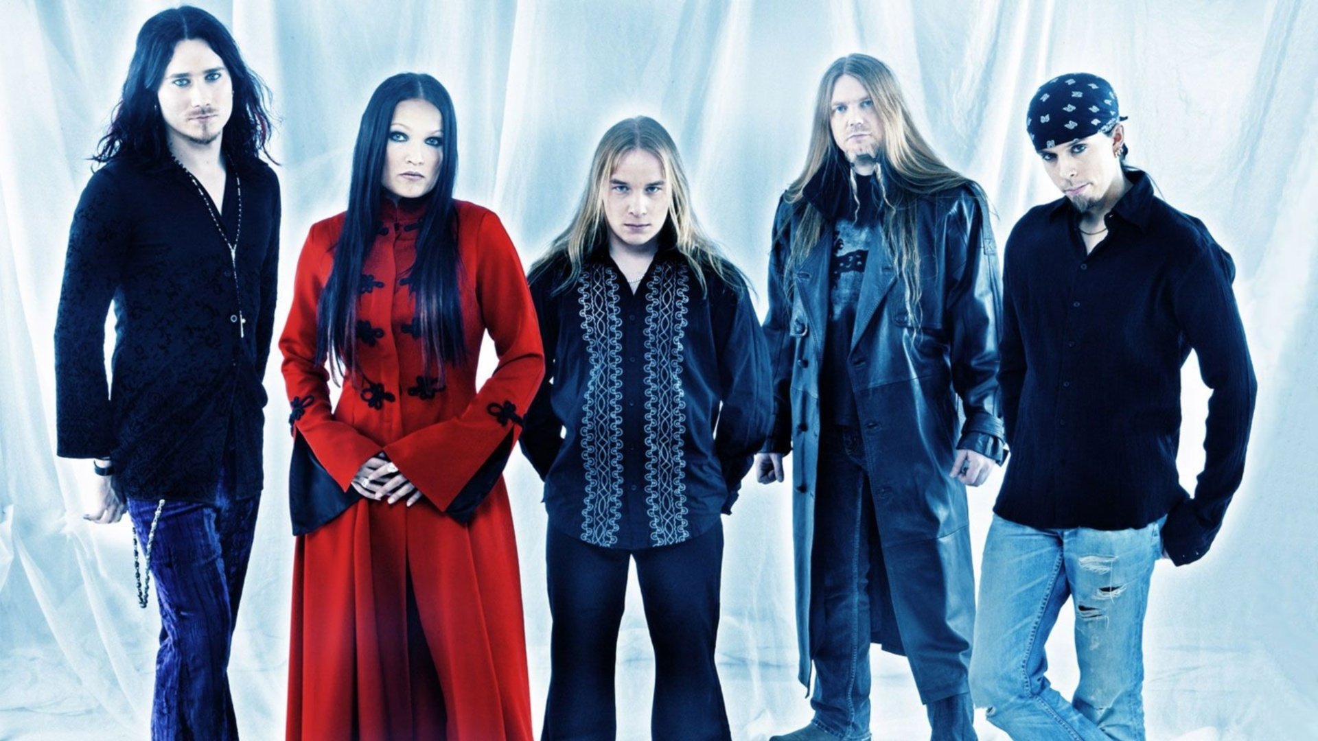 HD PC desktop wallpaper featuring the members of Nightwish, a symphonic metal band, against a bright, icy blue background.