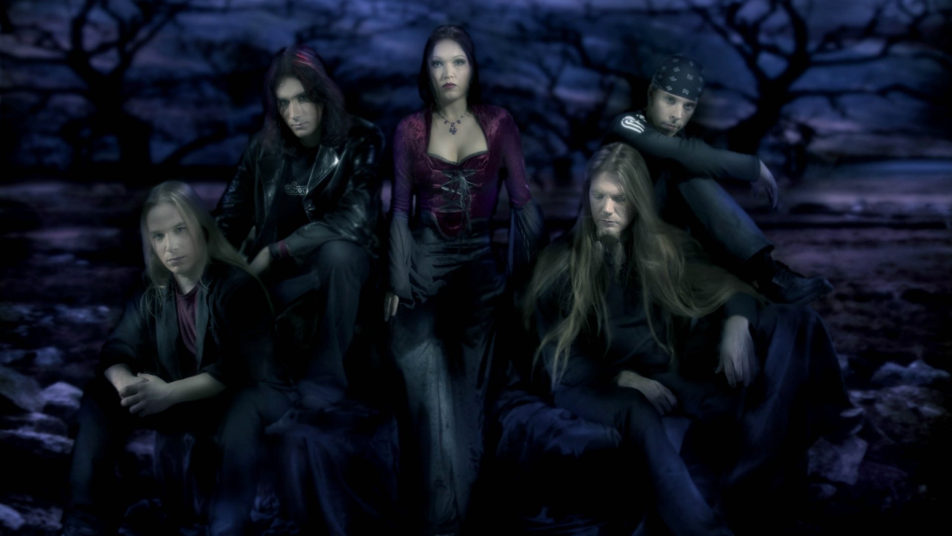 HD PC desktop wallpaper featuring the symphonic metal band Nightwish in a dark, moody setting, highlighting their gothic and mysterious aesthetic.