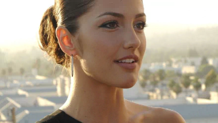 A high-definition desktop wallpaper featuring Minka Kelly, showcasing her in a serene outdoor setting with soft lighting and a stylish look.