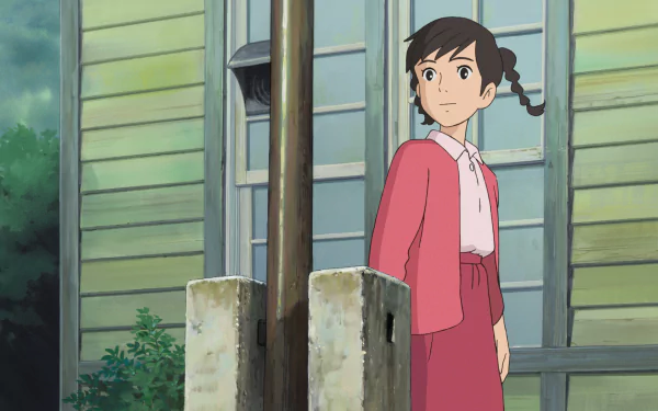HD wallpaper of a character from From Up On Poppy Hill standing by a gate with a house in the background.
