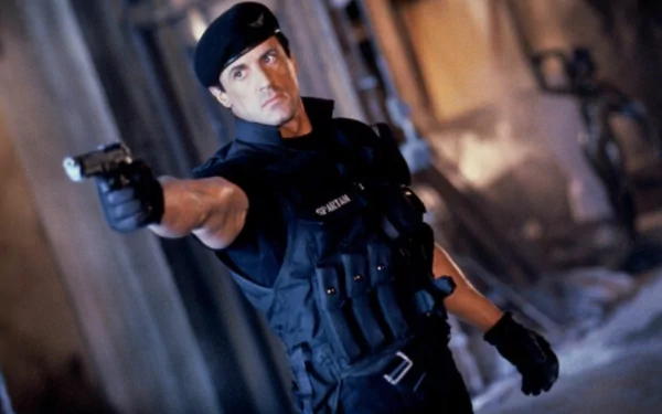 HD PC desktop wallpaper: gritty scene from the movie Demolition Man — a beret-clad tactical officer aims a pistol in a dim, industrial setting.