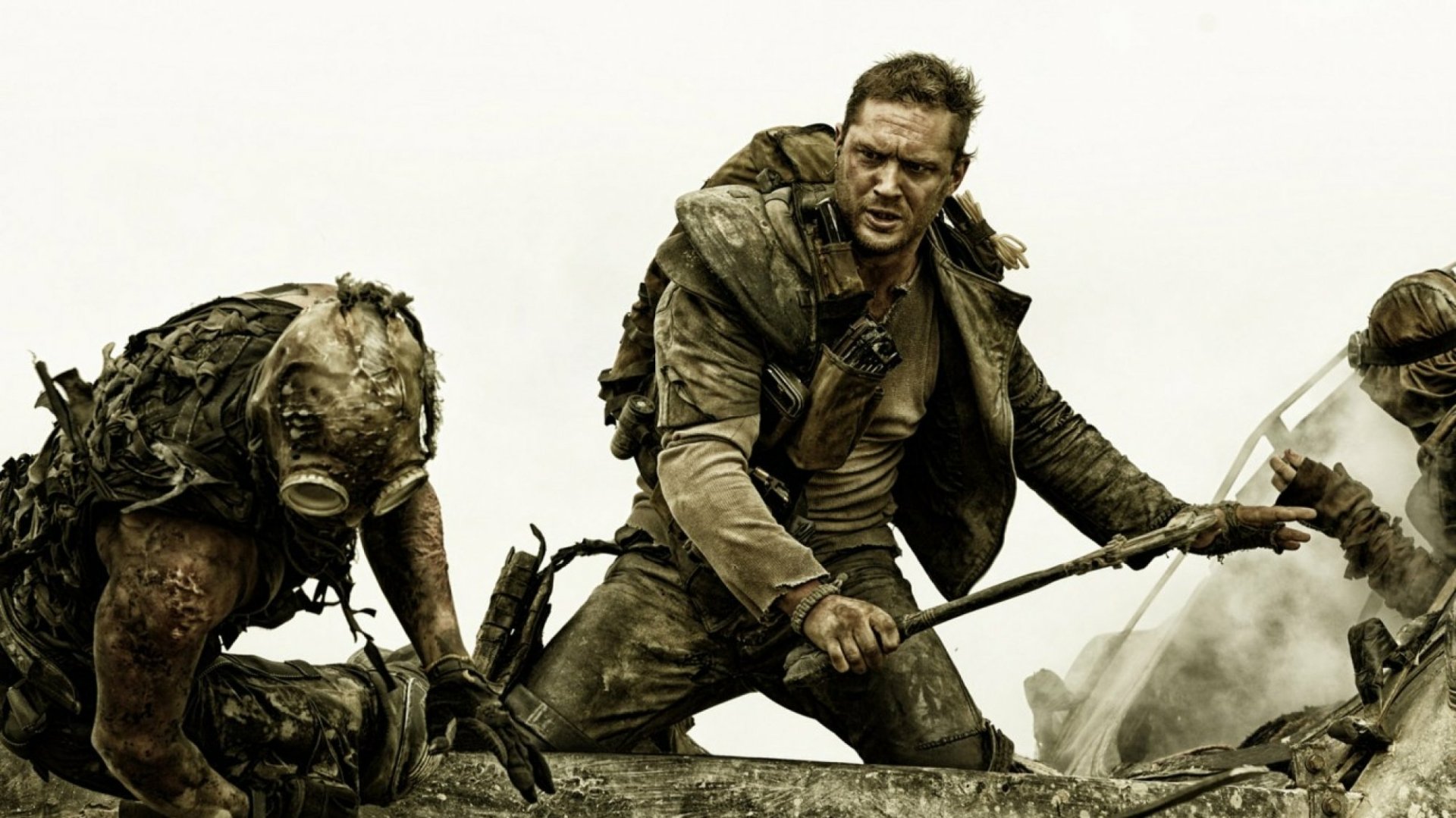 HD PC desktop wallpaper featuring Tom Hardy as Max Rockatansky in an intense scene from the movie Mad Max: Fury Road.