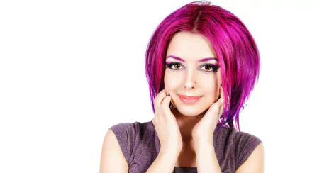HD desktop wallpaper and background featuring a woman with crimson hair, striking makeup, and a confident smile.