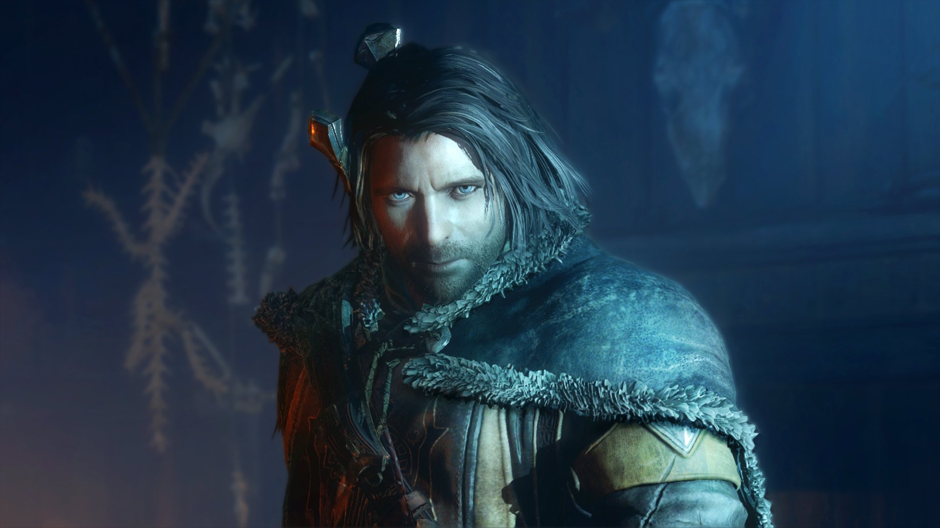 Close-up of a hooded, battle-worn ranger from the video game Middle-earth: Shadow of Mordor, bathed in blue light — 4K Ultra HD PC desktop wallpaper background.