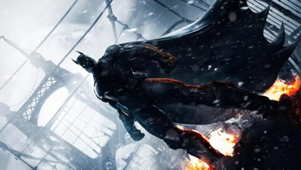 A dynamic HD wallpaper featuring Batman from Batman: Arkham Origins, showcasing the iconic character in a snowy, dramatic cityscape with flames in the background.