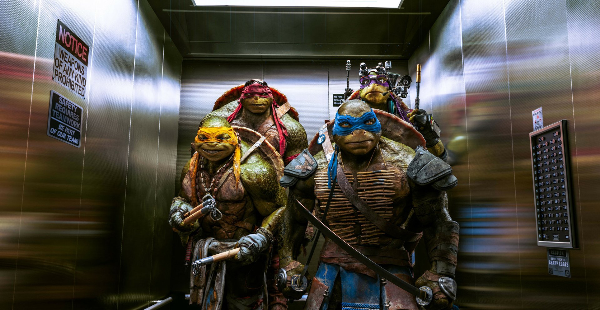 HD PC desktop wallpaper featuring the Teenage Mutant Ninja Turtles from the 2014 movie standing together in an elevator, showcasing their distinct weapons and vibrant colors.