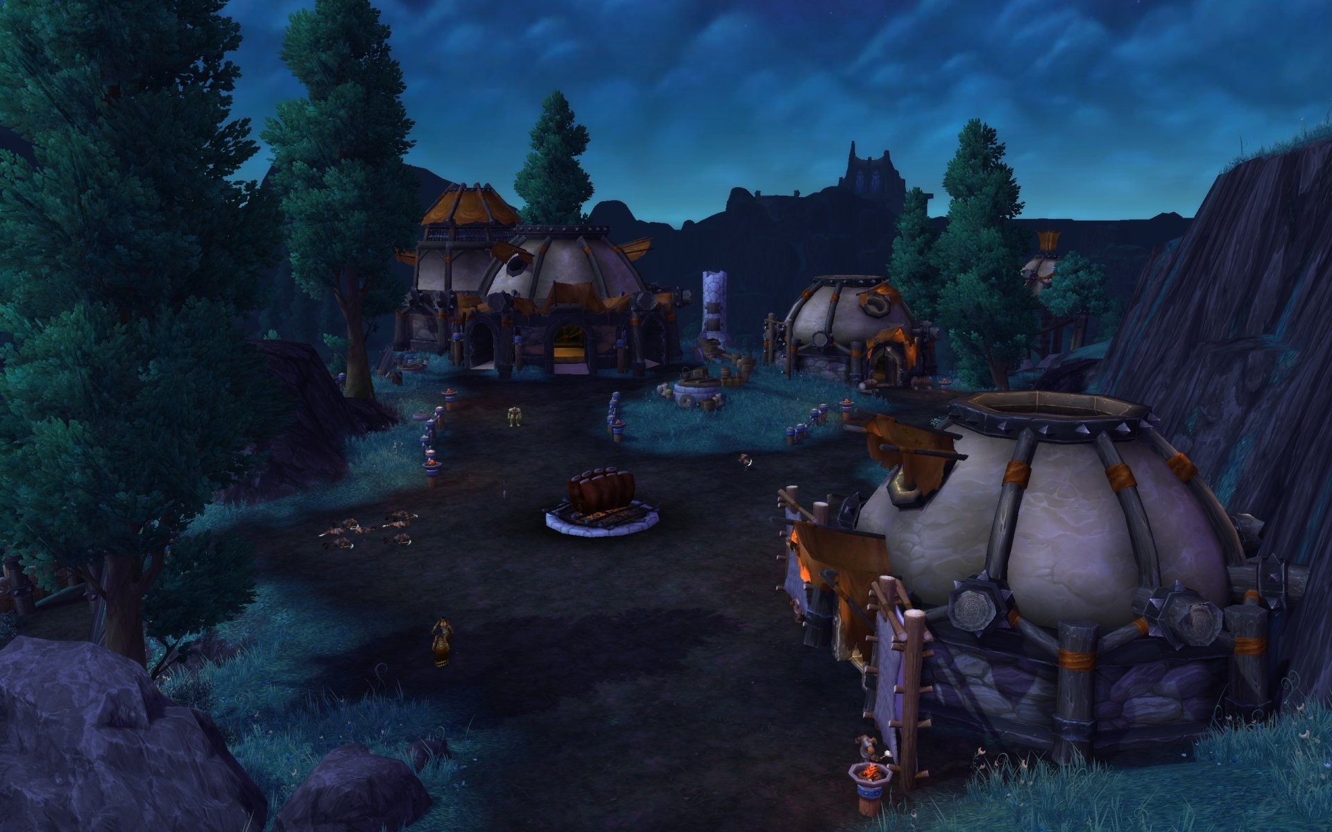 HD PC desktop wallpaper featuring a night scene from World of Warcraft: Warlords of Draenor, showcasing a village with tents and towering trees under a dark sky.