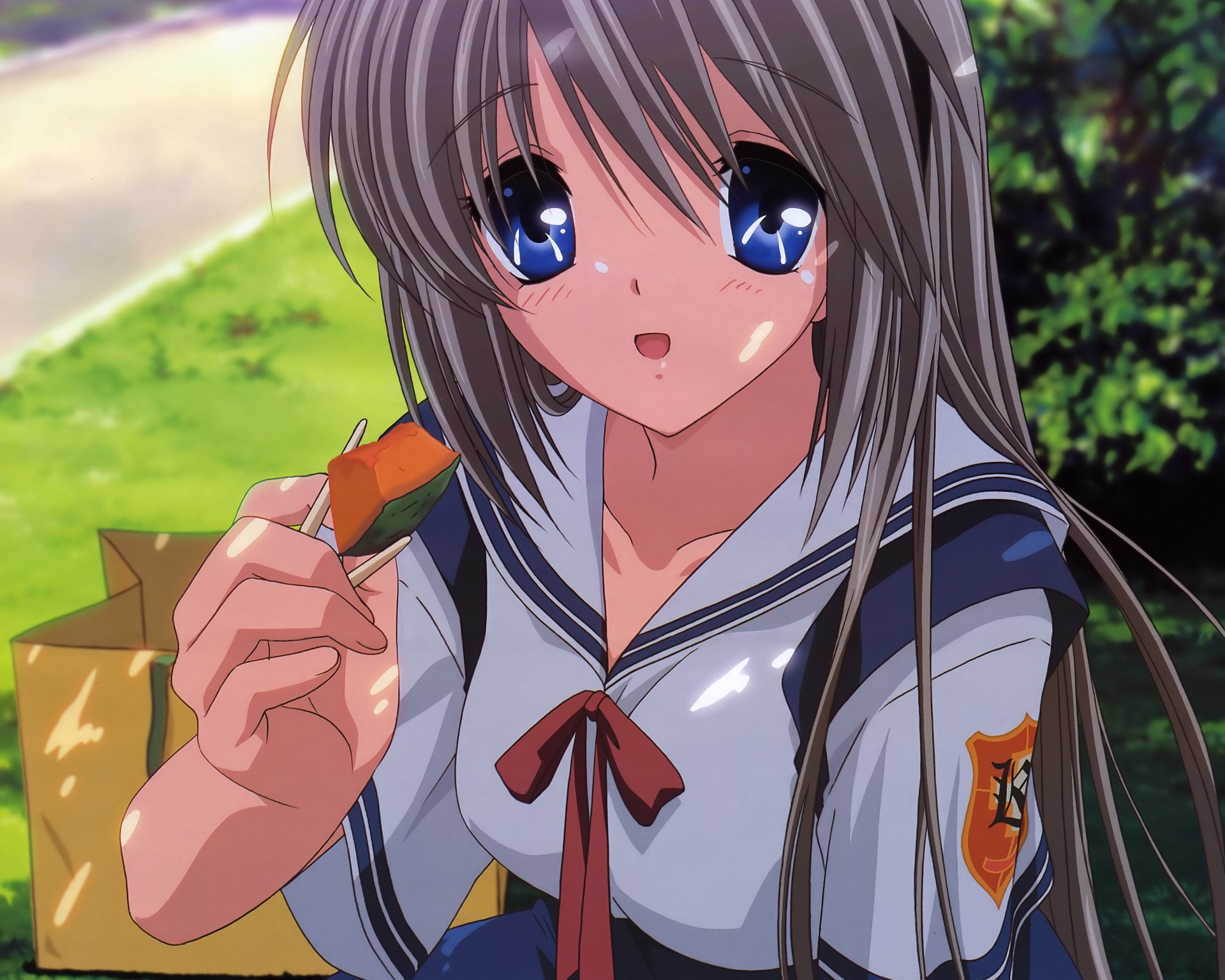 Tomoyo Sakagami from Clannad — anime portrait in school uniform eating a snack, blue eyes and long hair against a sunlit park scene, 4K Ultra HD PC desktop wallpaper/background.
