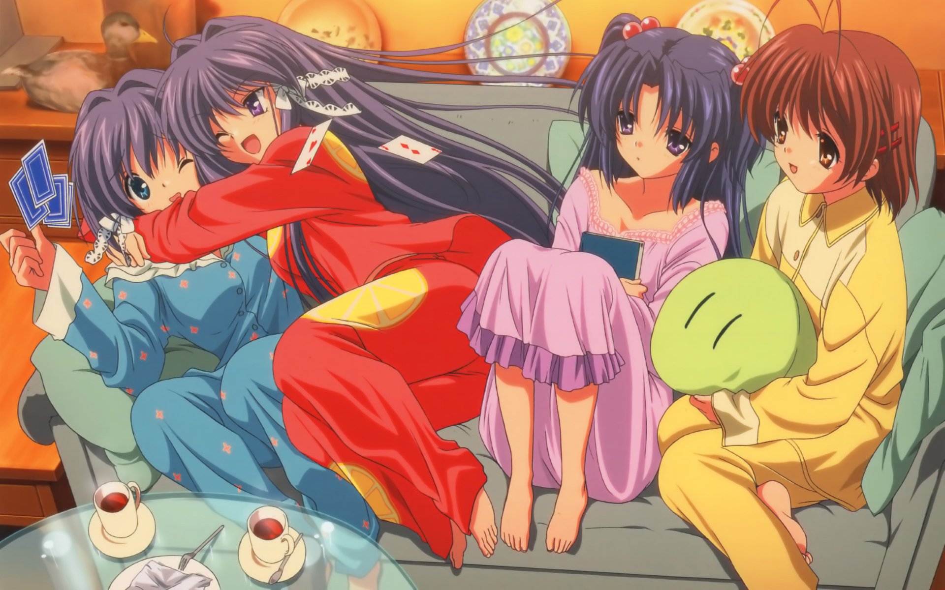 Anime Clannad 2K Quad HD PC desktop wallpaper: four girls in pajamas lounging on a couch with tea, plush toys and a warm evening glow.