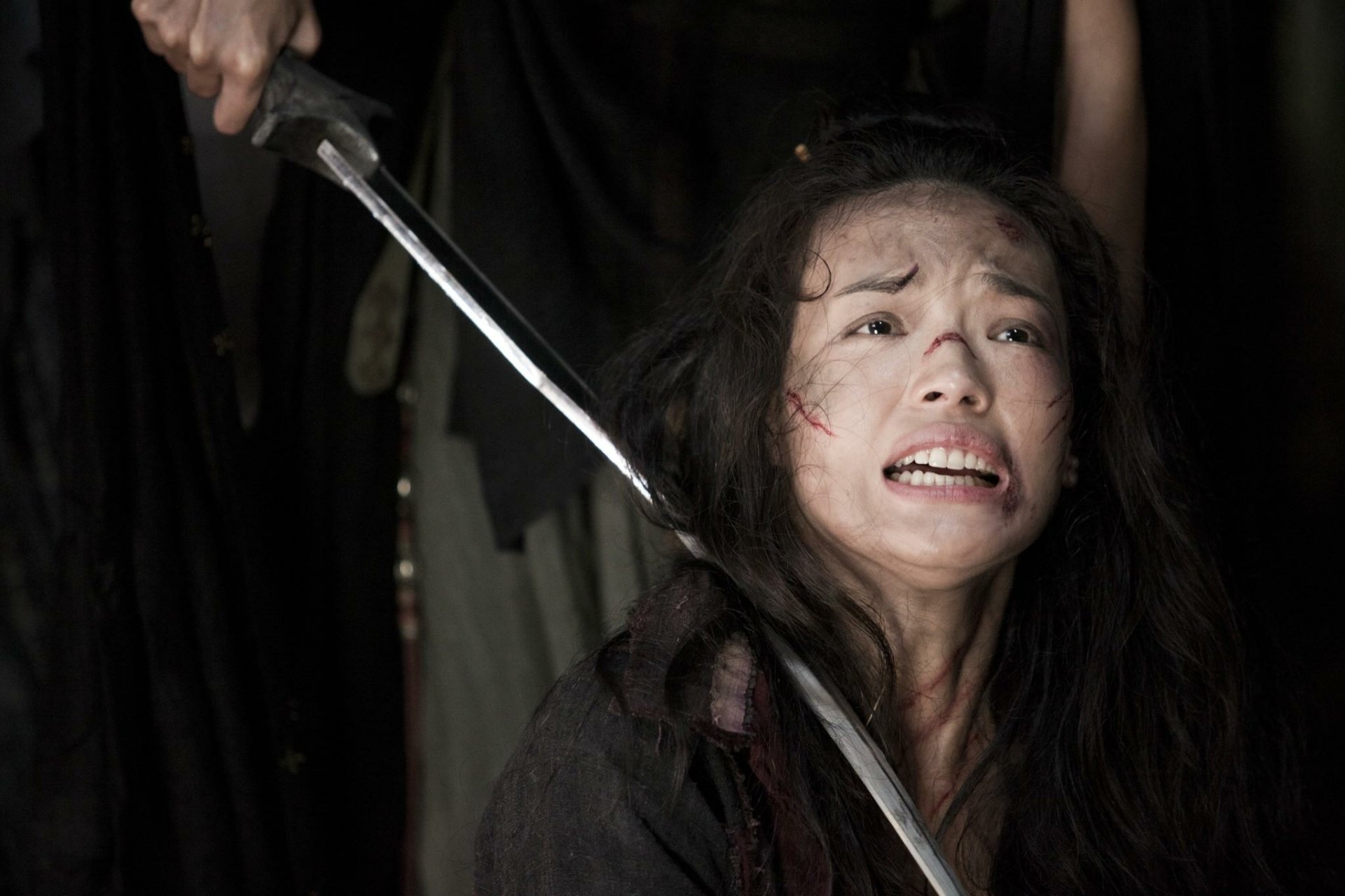 HD desktop wallpaper featuring a dramatic scene from Journey To The West with a distressed woman wielding a sword.