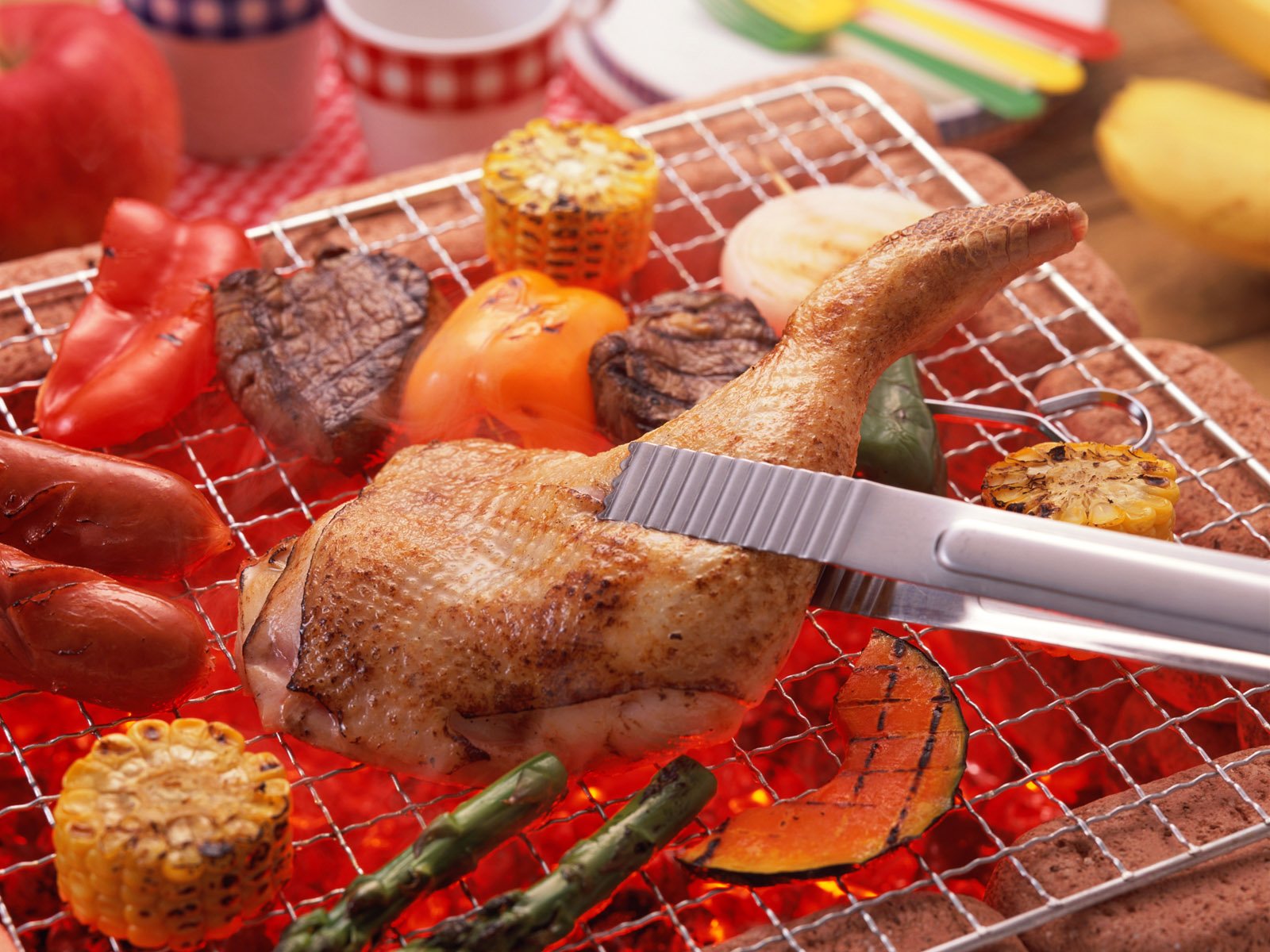 Grilled barbecue meal featuring chicken leg, corn, capsicum, peppers, and vegetables on a grill, captured in HD as a desktop wallpaper background.