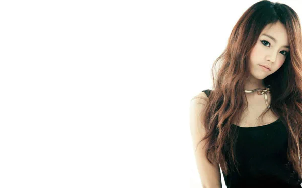 HD Korean K-pop music desktop wallpaper: solo female singer in a black dress against white negative space, minimalist KARA-era aesthetic.