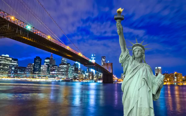 A stunning HD wallpaper of New York featuring the Statue of Liberty illuminated at night, with the Brooklyn Bridge and city skyline in the background. A vibrant urban scene.
