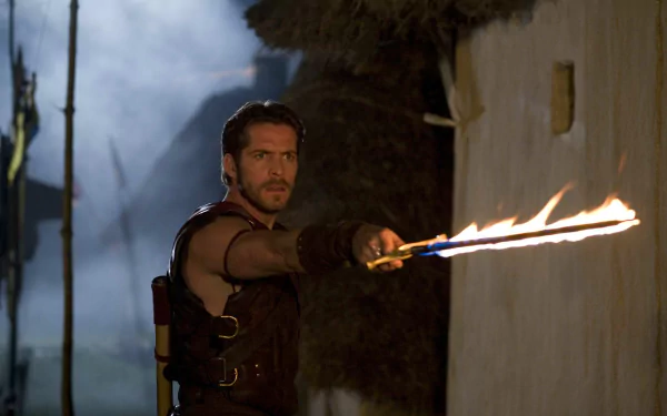 Kröd Mändoon from the TV show Kröd Mändoon and the Flaming Sword of Fire thrusts a blazing sword — cinematic HD PC desktop wallpaper/background.