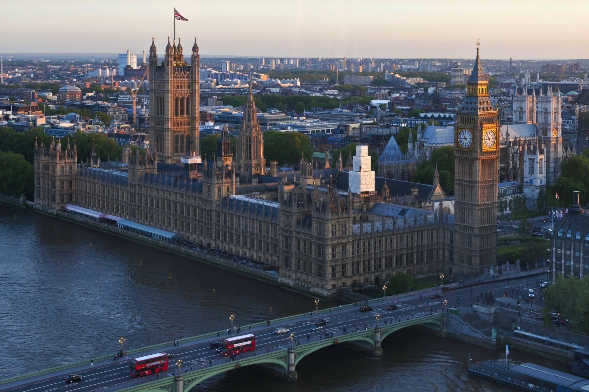 Aerial view of the Palace of Westminster and Big Ben in London, England, captured in high definition as a cityscape background along the River Thames.