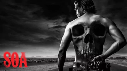 HD desktop wallpaper featuring a Sons of Anarchy theme with a man displaying a large skull tattoo on his back, under a stormy sky, with the SOA logo in red.